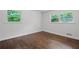 Charming bedroom with hardwood floors and natural light from two windows at 1971 Hooper St, Decatur, GA 30032
