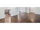 Hardwood floors create an inviting living space; kitchen and hall access at 1971 Hooper St, Decatur, GA 30032