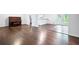 View of hardwood floors in the spacious living room with french doors and natural light at 1971 Hooper St, Decatur, GA 30032