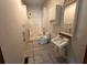 Bright bathroom featuring a tub and shower combination and classic single sink vanity at 29 Ivy St, Porterdale, GA 30014