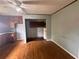 View of a kitchen with traditional cabinetry and wood-look floors connecting to an adjacent room at 29 Ivy St, Porterdale, GA 30014