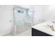 Bathroom with white marble-look shower and double sinks at 411 Riverclub Rd, Acworth, GA 30101