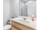 Bright bathroom featuring a single vanity, mirror, and walk-in shower at 411 Riverclub Rd, Acworth, GA 30101