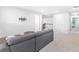 Second floor living room features plush carpet and comfortable grey sectional sofa at 411 Riverclub Rd, Acworth, GA 30101