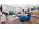 Bright living room with modern fireplace, hardwood floors, and an open layout to the kitchen at 411 Riverclub Rd, Acworth, GA 30101