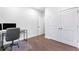 Home office featuring hardwood floors and closet with storage at 411 Riverclub Rd, Acworth, GA 30101