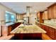 Kitchen featuring an island with gas cooktop, stainless steel appliances, and wood floors at 4265 Lansmoore Xing, Suwanee, GA 30024