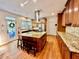 Open kitchen featuring a large island, stainless steel appliances, and granite countertops at 4265 Lansmoore Xing, Suwanee, GA 30024
