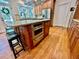 Kitchen featuring stainless steel appliances, granite countertops, and wood floors at 4265 Lansmoore Xing, Suwanee, GA 30024