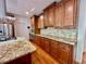 Elegant kitchen featuring stainless steel appliances, granite countertops, and custom cabinetry at 4265 Lansmoore Xing, Suwanee, GA 30024