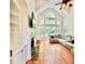 Bright living room with cathedral ceilings, large windows, and a fireplace at 4265 Lansmoore Xing, Suwanee, GA 30024