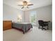 Neutral bedroom featuring carpet, a dresser, window with blinds and desk with chair at 4977 Meadow Ln, Marietta, GA 30068