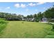 Townhome community features a large common green space perfect for Gathering activities at 4977 Meadow Ln, Marietta, GA 30068