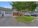 View of townhome featuring attached garage, fenced patio, and guest parking at 4977 Meadow Ln, Marietta, GA 30068