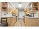 Well-lit kitchen with wood cabinets, granite countertops, and updated appliances at 4977 Meadow Ln, Marietta, GA 30068