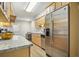 Bright kitchen featuring granite countertops and stainless steel appliances, offering a modern cooking space at 4977 Meadow Ln, Marietta, GA 30068