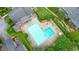 Aerial view of a community pool with sun loungers and well-maintained green spaces at 4977 Meadow Ln, Marietta, GA 30068
