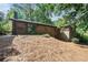 Exterior shot of the backyard with a patio and brick exterior at 1260 Fork Creek Trl, Decatur, GA 30033