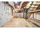 View of the unfinished basement with concrete block walls and exposed ceiling at 1260 Fork Creek Trl, Decatur, GA 30033