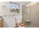 Well-lit bathroom with shower, toilet, granite counter, and wooden cabinets at 1260 Fork Creek Trl, Decatur, GA 30033