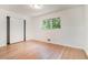 Comfortable bedroom with hardwood floors, ample closet space, and a bright window at 1260 Fork Creek Trl, Decatur, GA 30033