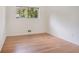Neutral bedroom with hardwood floors and natural light, offering a serene atmosphere at 1260 Fork Creek Trl, Decatur, GA 30033