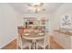 Dining room with hardwood floors and open view into kitchen at 1260 Fork Creek Trl, Decatur, GA 30033