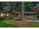 Charming brick home with a well-maintained lawn and an attached two-car garage at 1260 Fork Creek Trl, Decatur, GA 30033