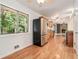 Open living room with hardwood floors, a brick fireplace, and sliding glass doors at 1260 Fork Creek Trl, Decatur, GA 30033