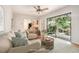 This living room boasts hardwood floors, ample seating, and a sliding glass door to the yard at 1260 Fork Creek Trl, Decatur, GA 30033
