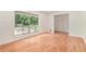 Inviting living room featuring beautiful hardwood floors and abundant natural light at 1260 Fork Creek Trl, Decatur, GA 30033