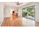 Bright living room featuring hardwood floors, ceiling fan and sliding glass doors leading to the backyard at 1260 Fork Creek Trl, Decatur, GA 30033