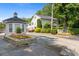 Scenic community entrance with a stone gatehouse and beautifully landscaped grounds, creating an inviting atmosphere at 136 Peachtree Memorial Nw Dr # Ct-6, Atlanta, GA 30309