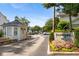 Charming community entrance with meticulously landscaped grounds and a secure gatehouse at 136 Peachtree Memorial Nw Dr # Ct-6, Atlanta, GA 30309