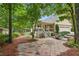Backyard featuring a patio, landscaped beds, and a screened in porch at 1420 Pilgrim Rd, Cumming, GA 30040