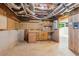 Unfinished basement featuring a sink and wooden cabinets at 1420 Pilgrim Rd, Cumming, GA 30040