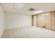 Finished basement with carpet and wood paneling, offering a versatile space at 1420 Pilgrim Rd, Cumming, GA 30040