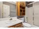 Bathroom featuring a sink with cabinet, toilet, and shower with glass door at 1420 Pilgrim Rd, Cumming, GA 30040