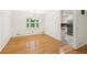 Dining room with hardwood floors and view of kitchen at 1420 Pilgrim Rd, Cumming, GA 30040