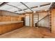 Spacious garage with work bench, shelving, and ample storage options at 1420 Pilgrim Rd, Cumming, GA 30040