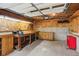 Unfinished garage featuring a workbench and storage at 1420 Pilgrim Rd, Cumming, GA 30040