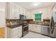 Kitchen with stainless appliances, granite countertops, plentiful cabinets, and tile backsplash at 1420 Pilgrim Rd, Cumming, GA 30040