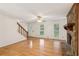 Open living room with hardwood floors and fireplace at 1420 Pilgrim Rd, Cumming, GA 30040