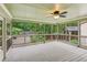 Inviting screened porch with wooded views, offering a relaxing outdoor living space at 1420 Pilgrim Rd, Cumming, GA 30040