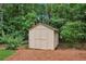 Storage shed in a wooded backyard at 1420 Pilgrim Rd, Cumming, GA 30040
