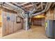 Basement utility area with HVAC, water heater, and essential systems readily accessible at 1420 Pilgrim Rd, Cumming, GA 30040