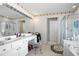 Bathroom with double vanity and floral patterned ceiling trim at 3616 Myrtlewood Nw Ct, Kennesaw, GA 30144