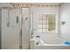 Bright bathroom featuring a shower and soaking tub at 3616 Myrtlewood Nw Ct, Kennesaw, GA 30144