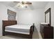 Bedroom features a ceiling fan, and a dresser with a mirror at 3616 Myrtlewood Nw Ct, Kennesaw, GA 30144
