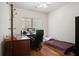 Small bedroom with hardwood floors, large window and good natural light at 3616 Myrtlewood Nw Ct, Kennesaw, GA 30144